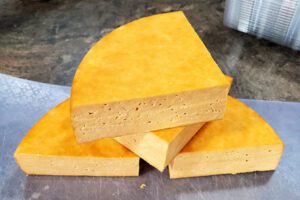 Wedges of Irish cheddar cheese made with milk from Kinder does.